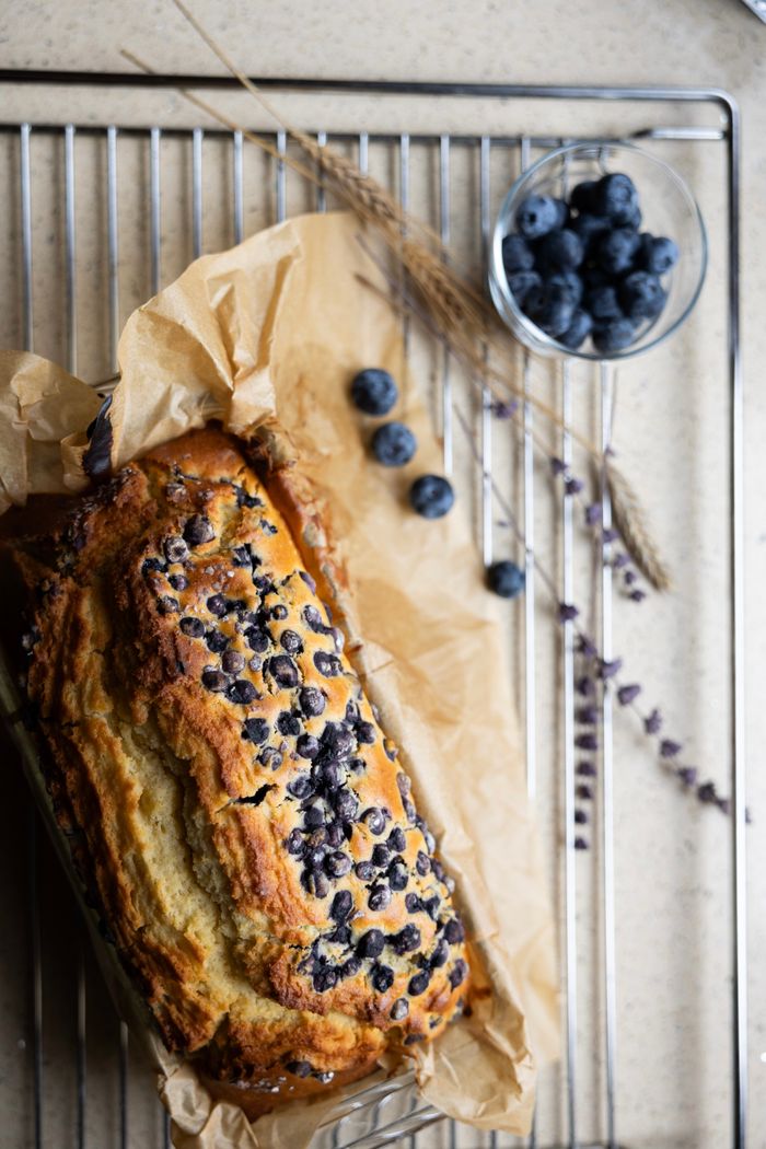 Mastering the First Impression: Your intriguing post title goes here Delicious homemade blueberry cake with fresh berries on parchment paper.